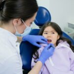 Pediatric Dentist treating child