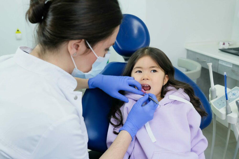 Pediatric Dentist treating child